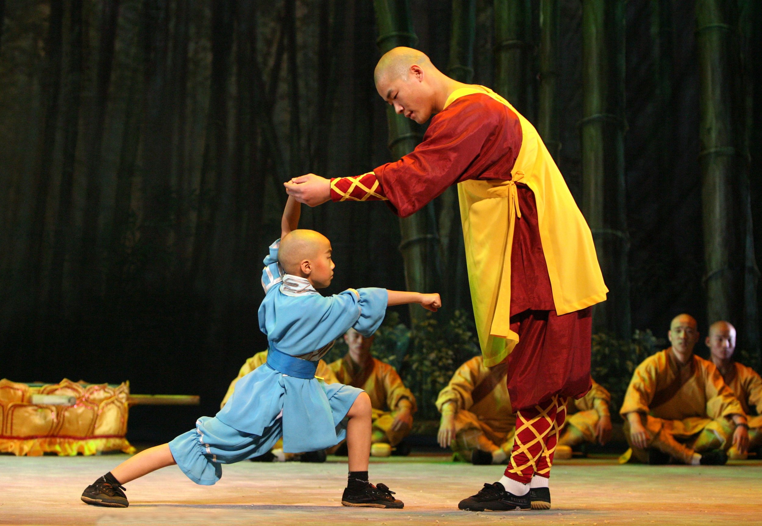 Young Hui Guang training with his master on stage
